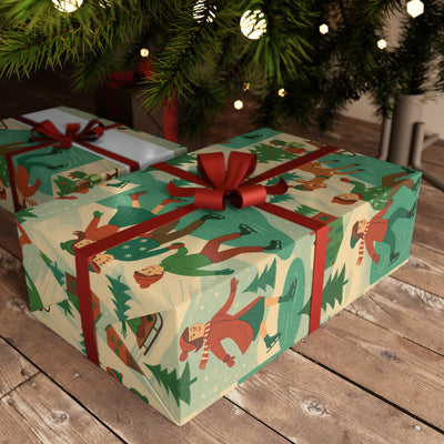 Winter Holiday Gift Wrap Sheets Festive Paper for Christmas on beautifully wrapped presents under a tree.
